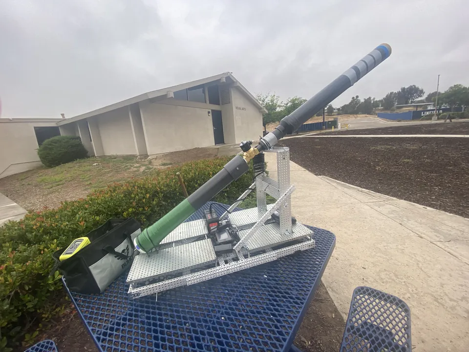 The pneumatic T-shirt launcher mounted on its VEX base